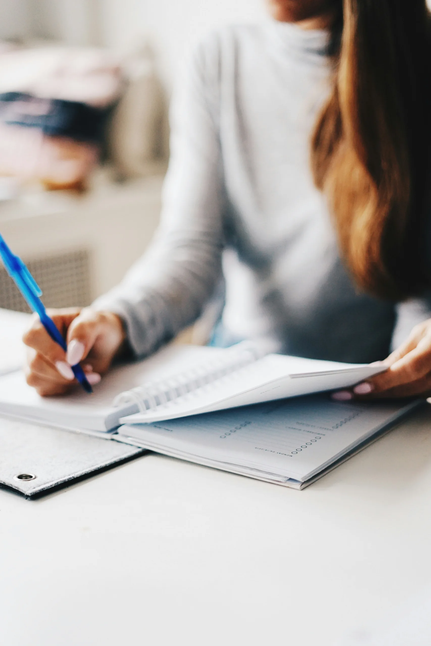 living intentionally, woman writing using pen